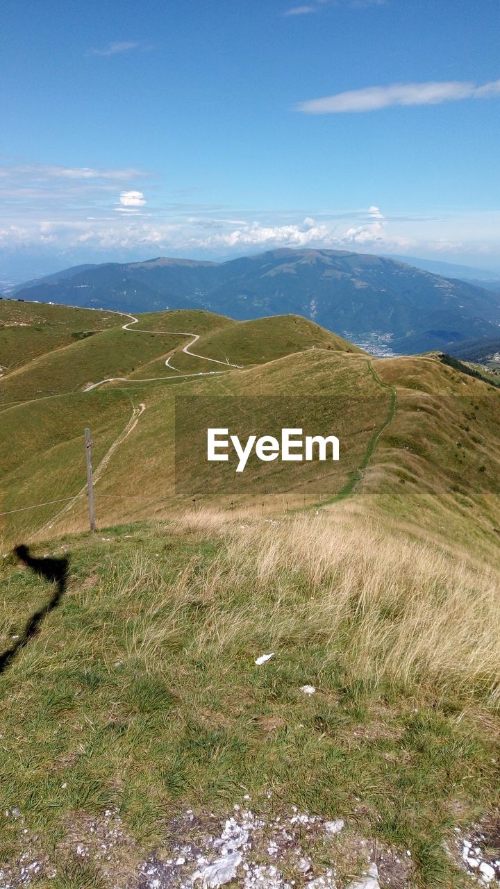 SCENIC VIEW OF LANDSCAPE AND MOUNTAIN AGAINST SKY