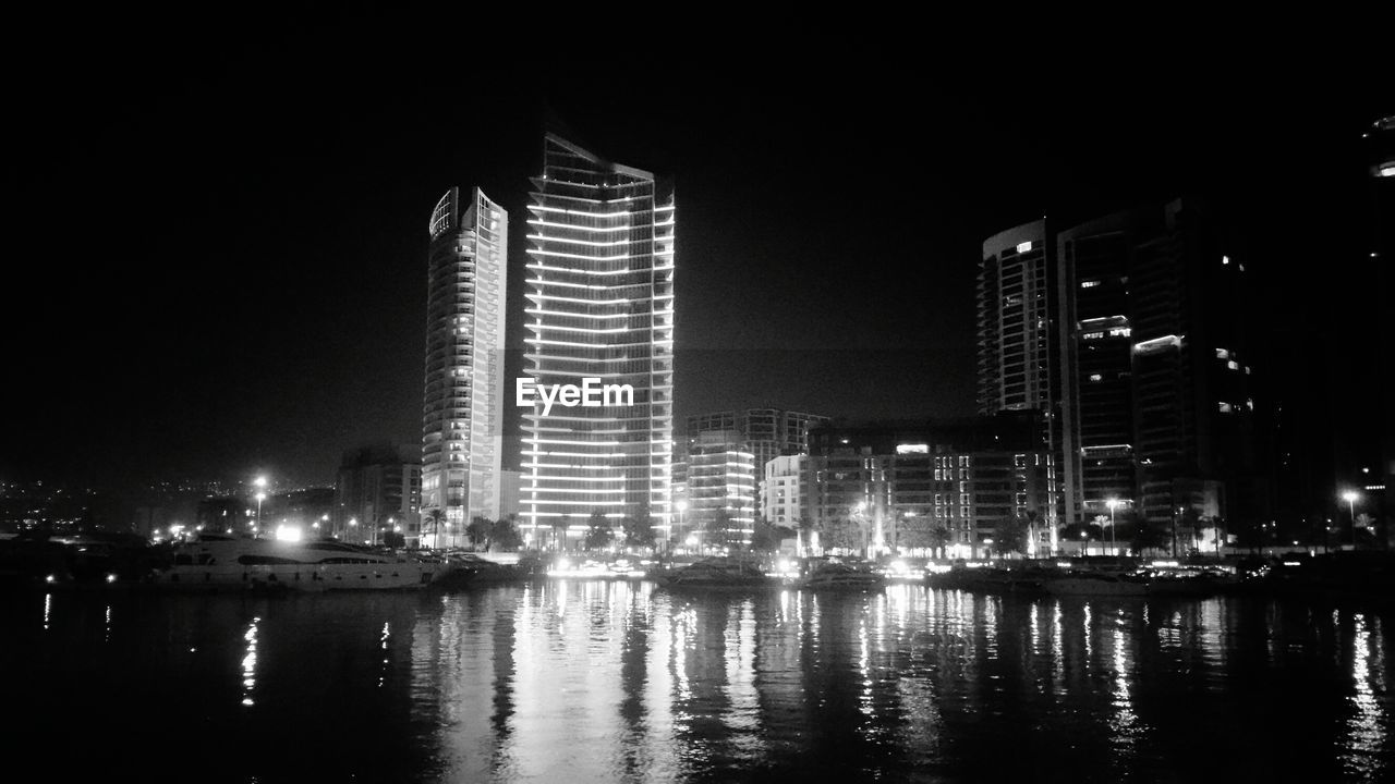 VIEW OF ILLUMINATED CITY AT NIGHT