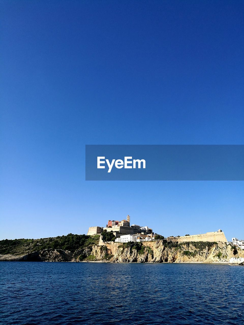 BUILT STRUCTURES AGAINST CLEAR BLUE SKY