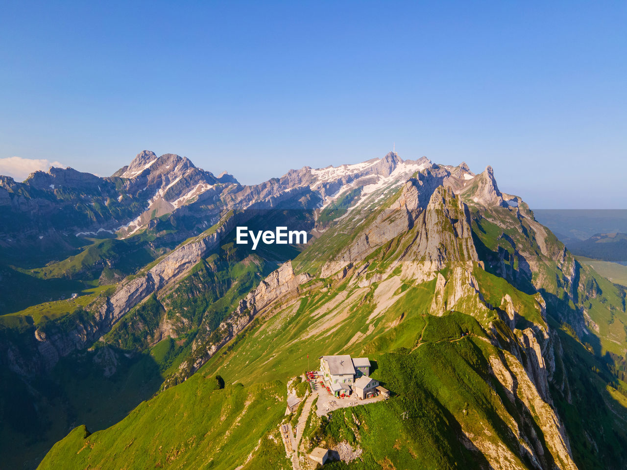 SCENIC VIEW OF MOUNTAINS AGAINST BLUE SKY