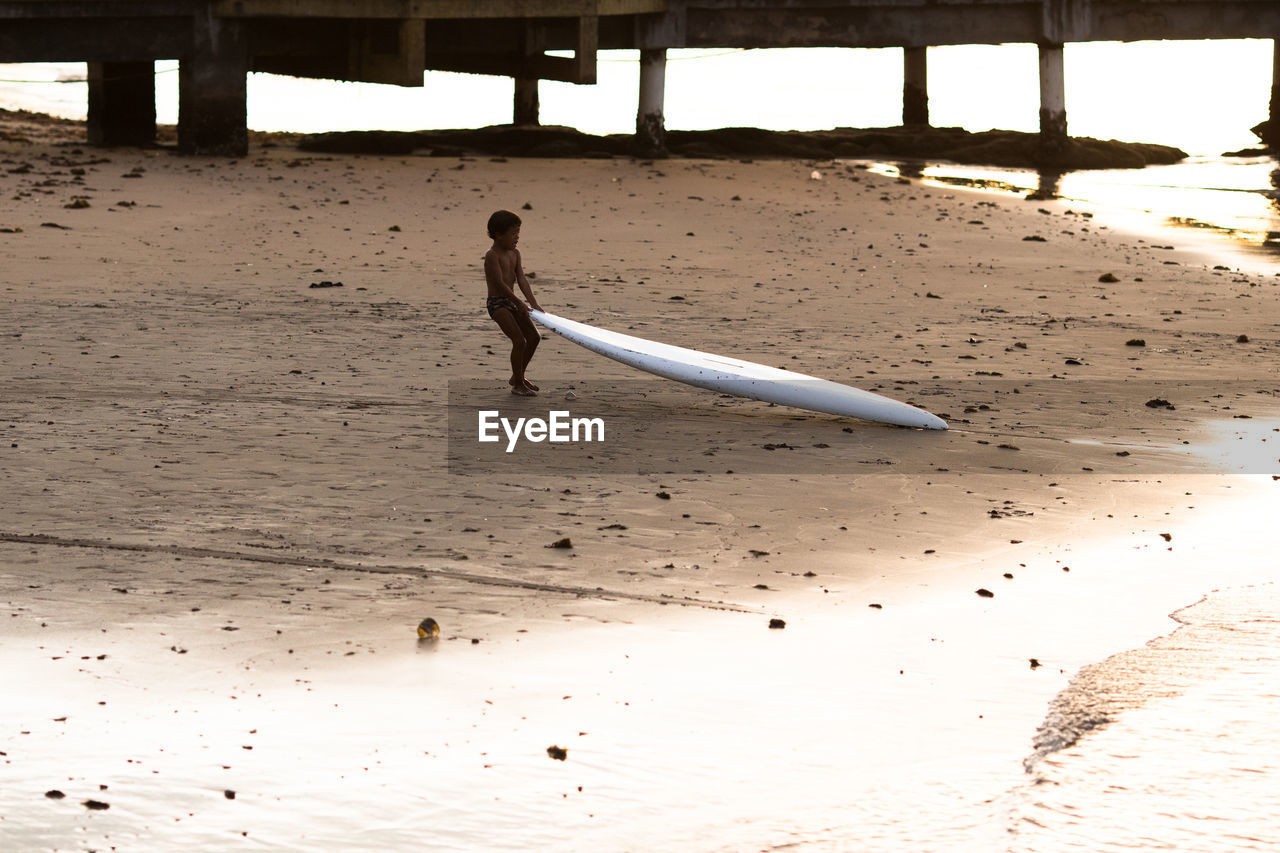 FULL LENGTH OF CHILD ON BEACH