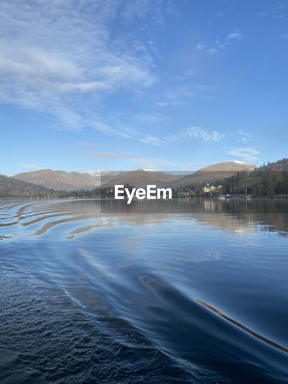 Scenic view of lake against blue sky