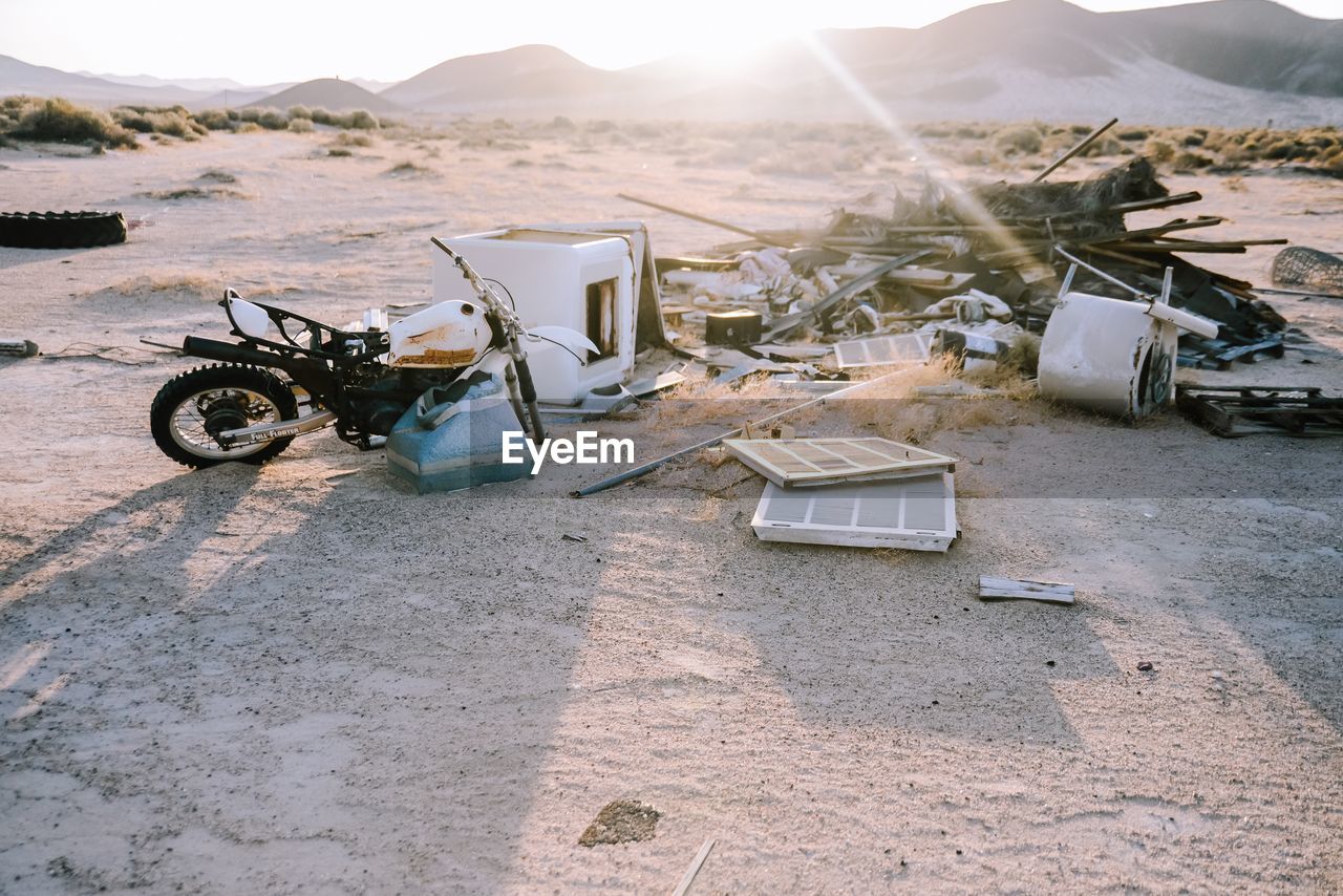 High angle view of junk strewn across a barren landscape