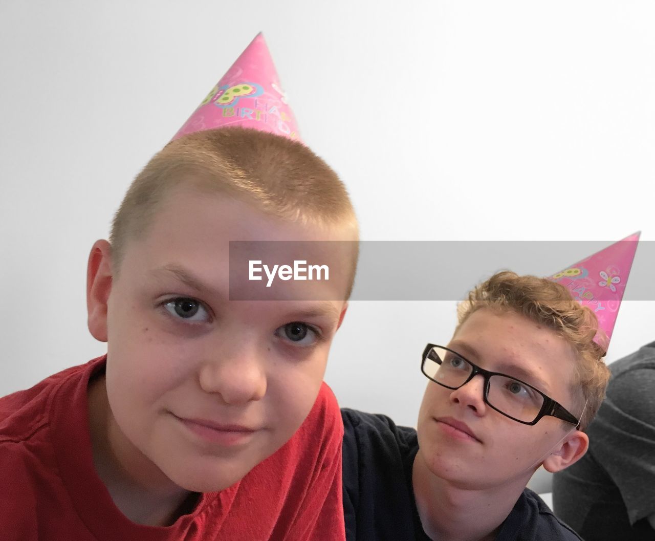 PORTRAIT OF BOY WEARING EYEGLASSES AND HAT