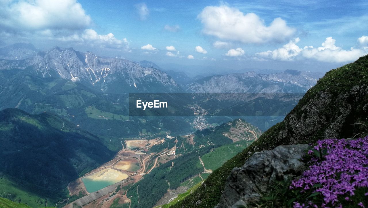 High angle view of valley and mountains against sky