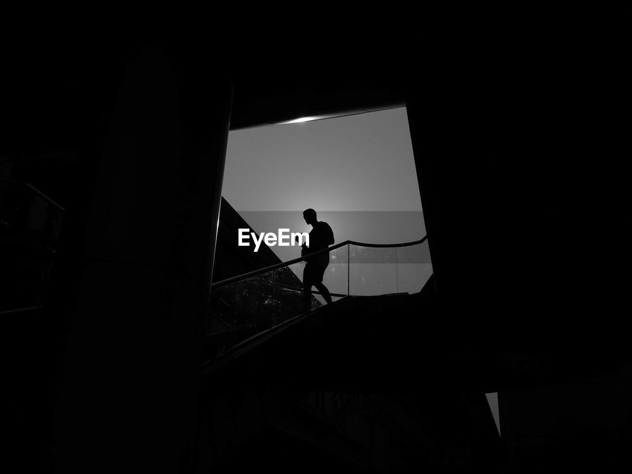 Silhouette man on staircase