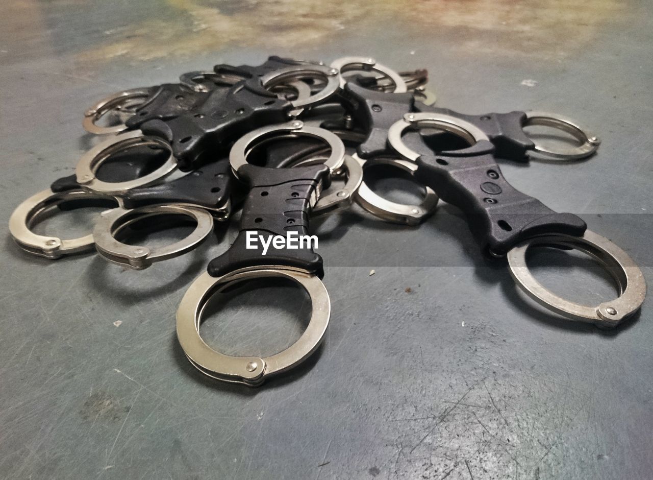 High angle view of handcuffs on floor