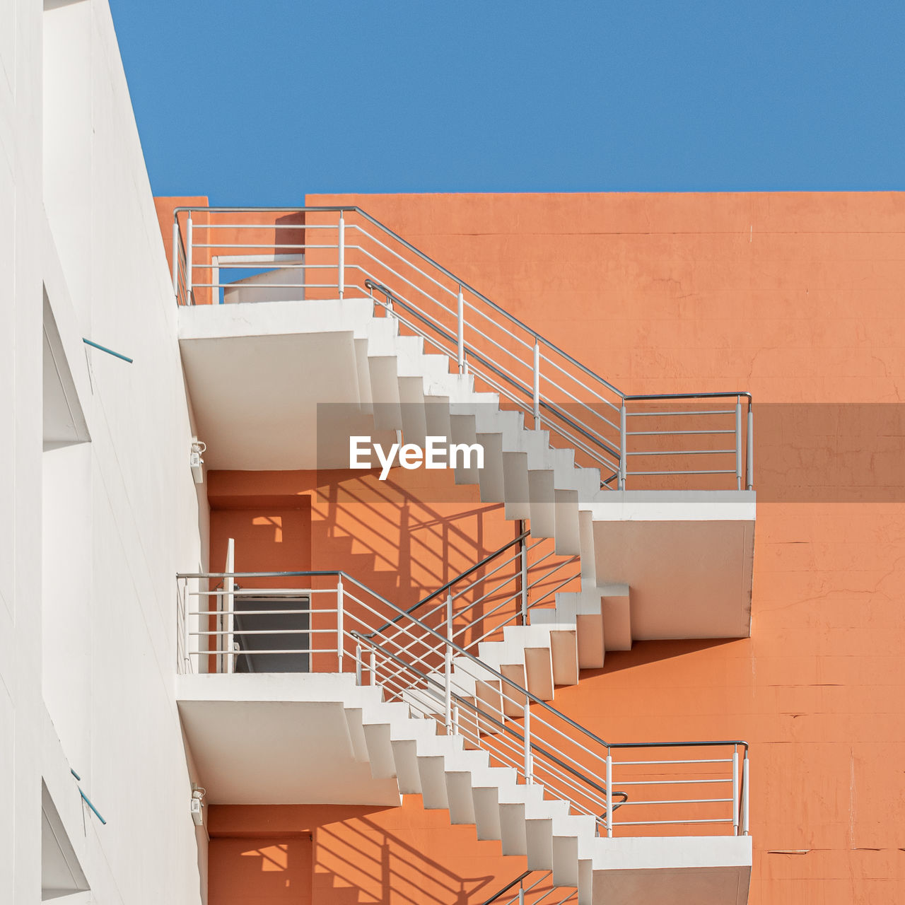 Low angle view of spiral staircase of building against clear sky