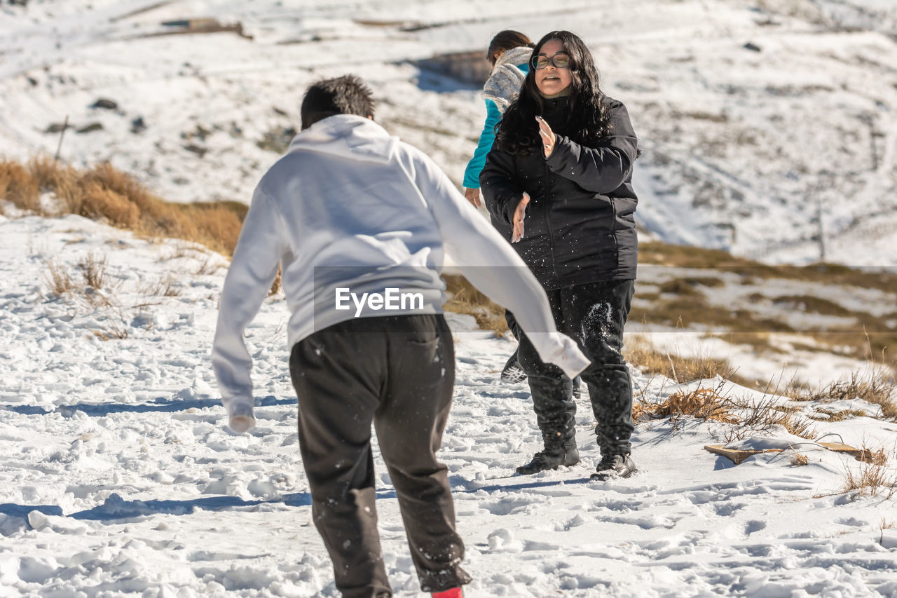 Playing in the snow with the snow at the ski resort in granada, sierra nevada, andalucia spain