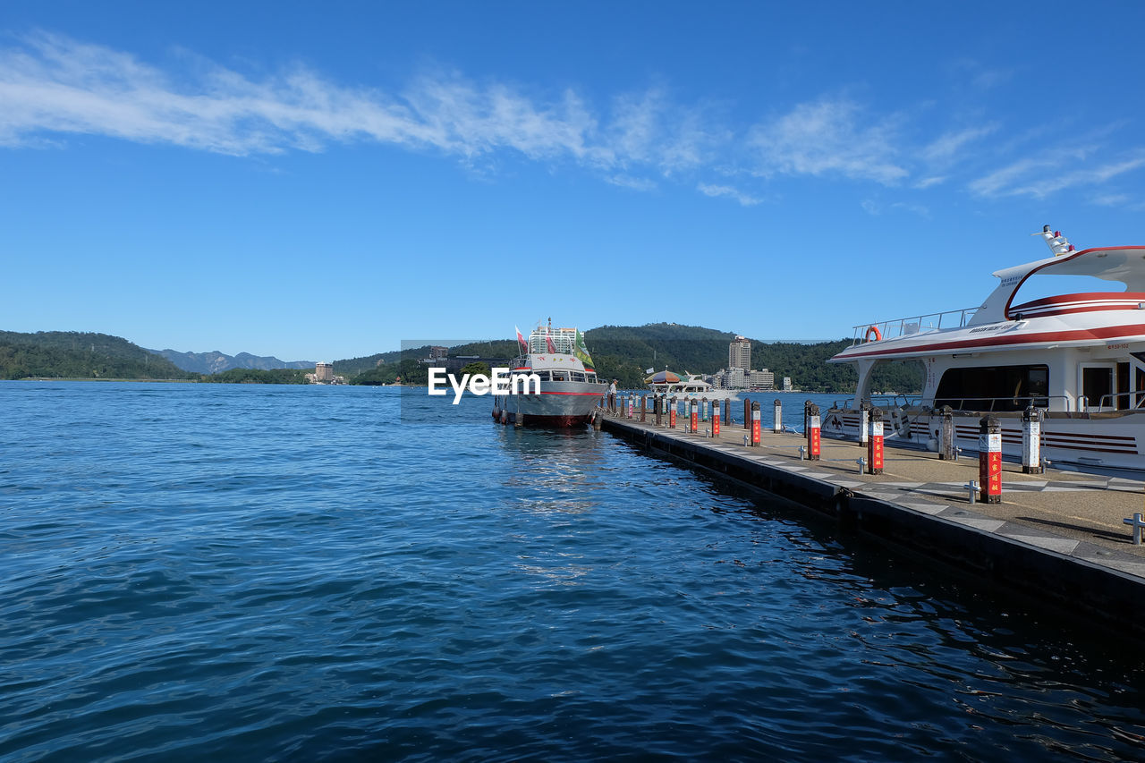 SCENIC VIEW OF SEA AGAINST BUILDINGS