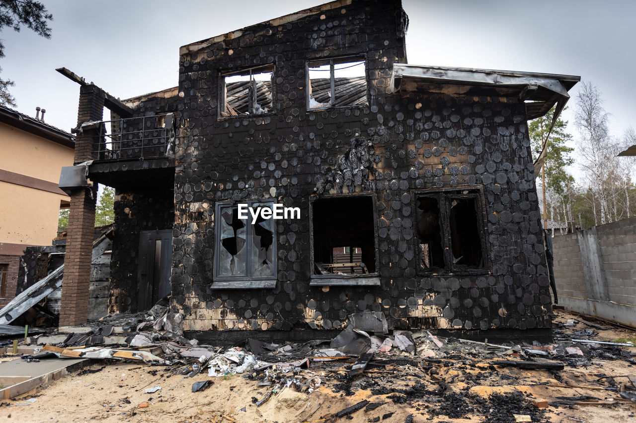 Destroyed buildings on the streets of irpen. broken windows. buildings after being hit by missiles.