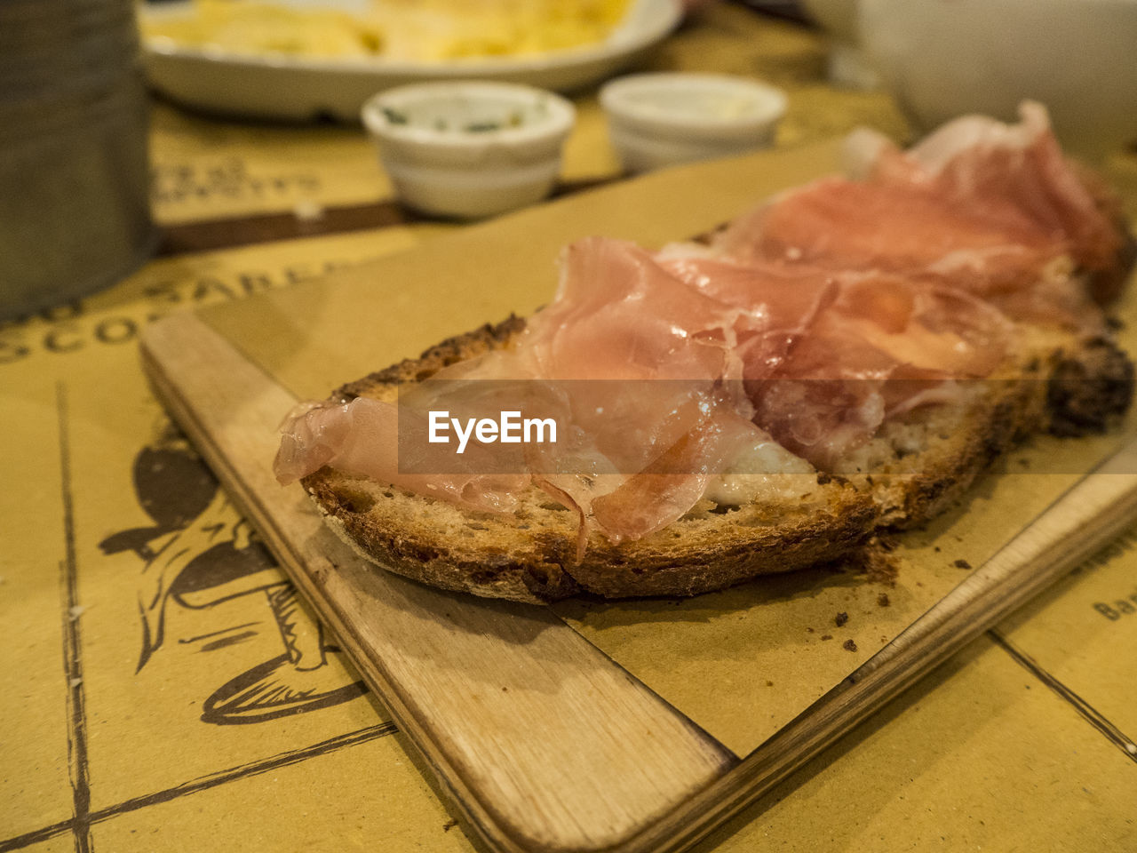 CLOSE-UP OF MEAT ON TABLE
