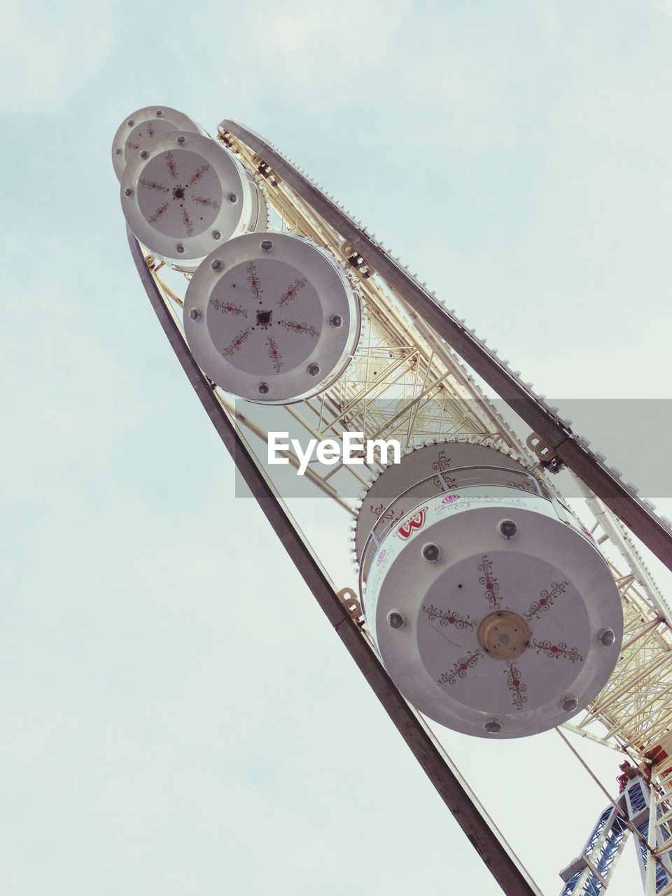 Low angle view of ferris wheel against sky