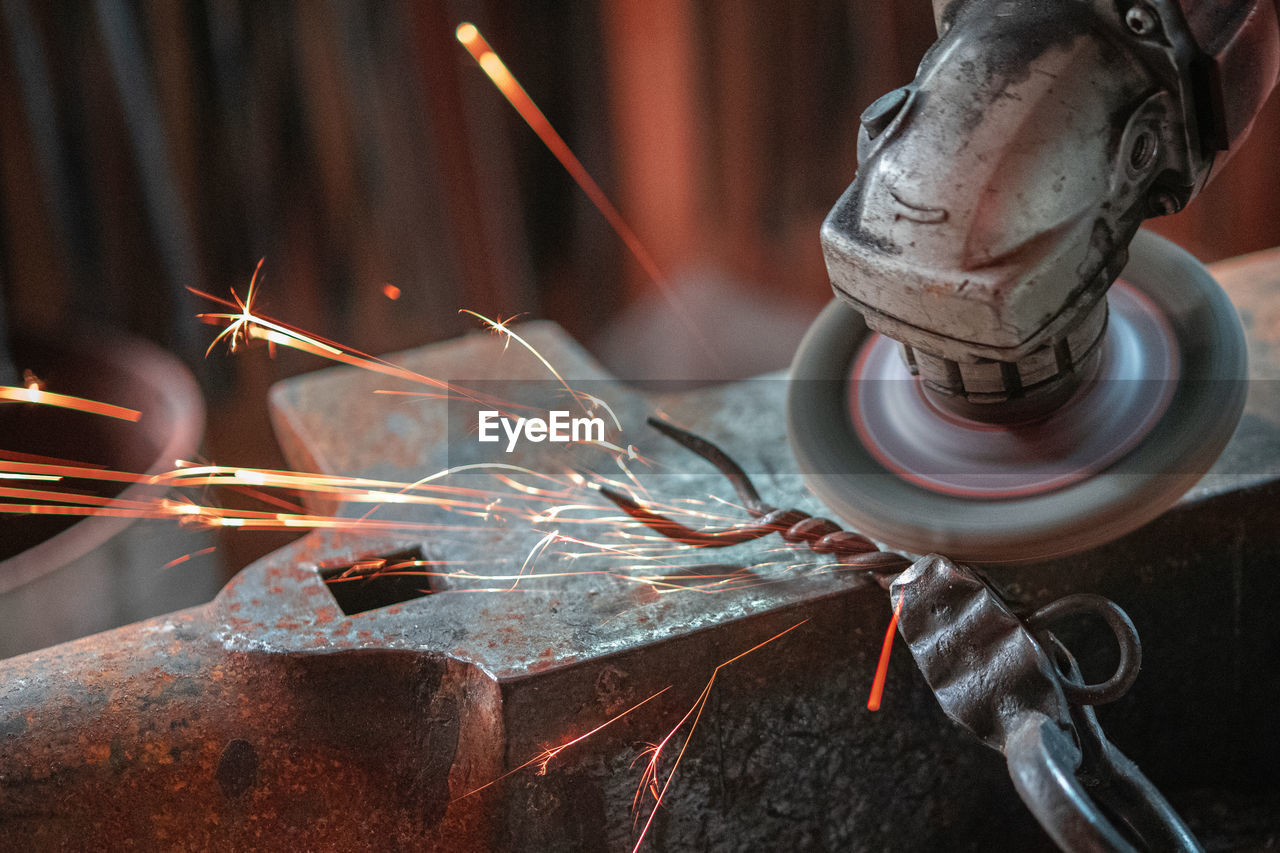 Close-up of rusty machine part in factory