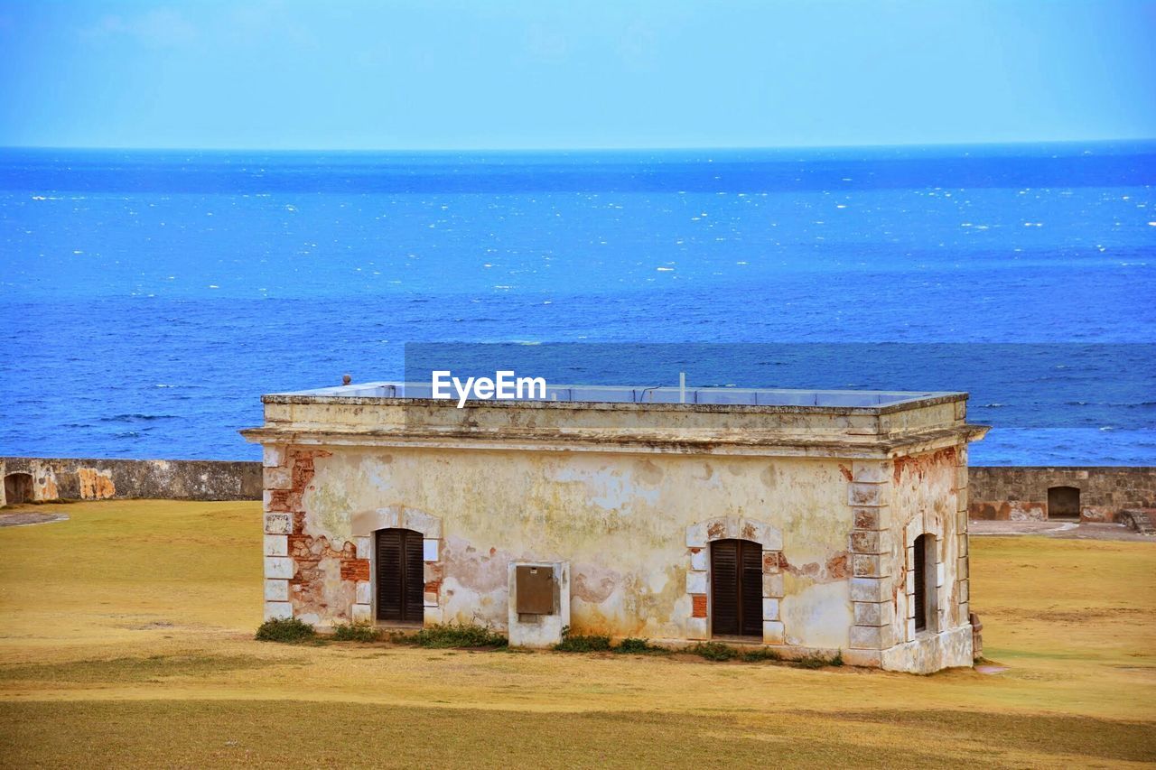 Scenic view of calm sea against blue sky