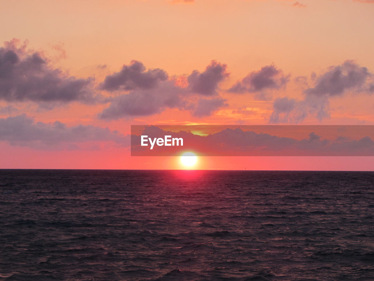 SUNSET OVER SEA