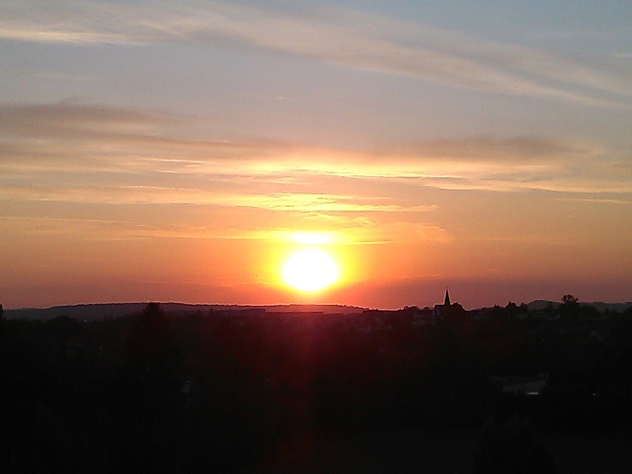 SILHOUETTE OF LANDSCAPE AT SUNSET