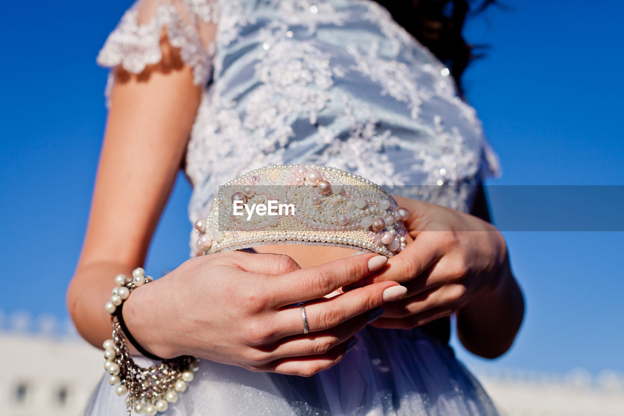 Close-up of hand holding headband