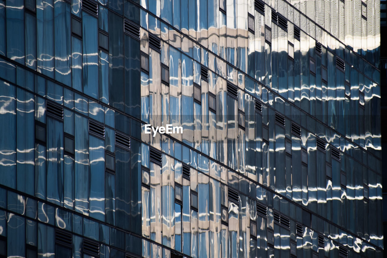 LOW ANGLE VIEW OF MODERN BUILDINGS