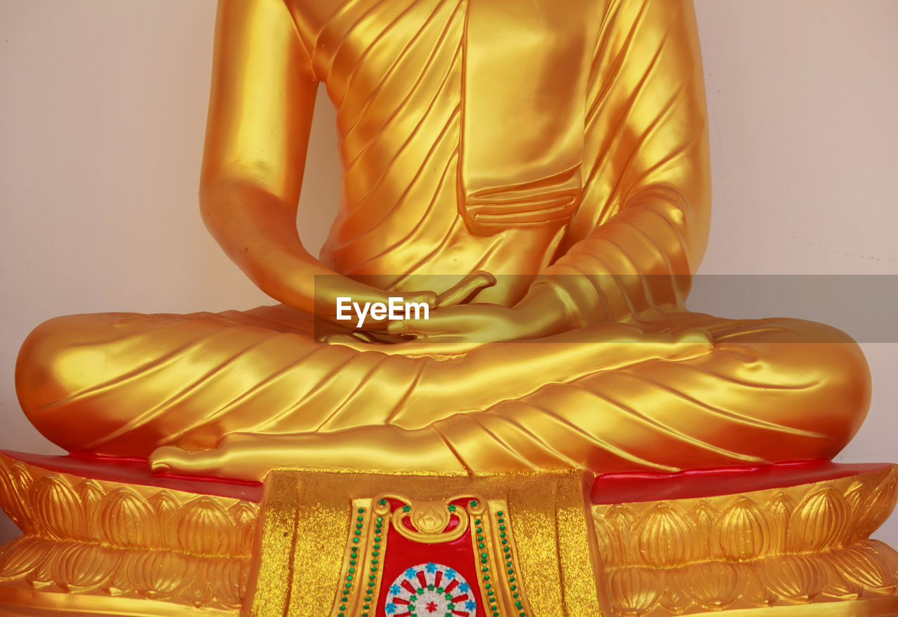 Close-up of yellow statue