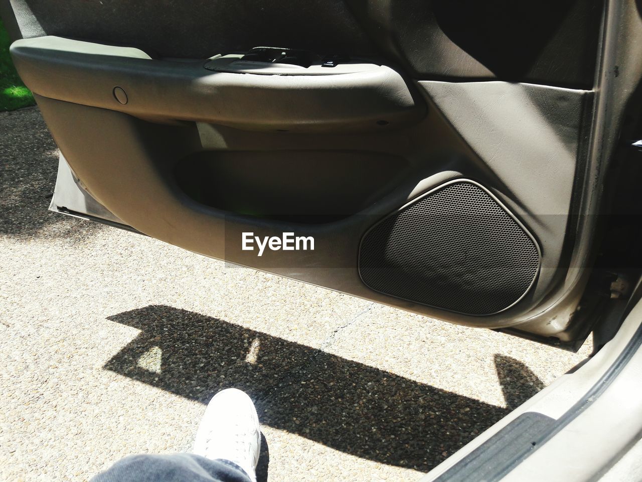 LOW SECTION OF PERSON STANDING ON ROAD