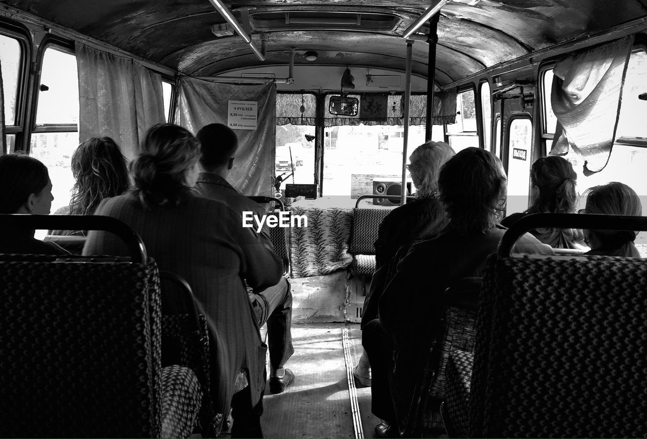 Rear view of passenger sitting on bus
