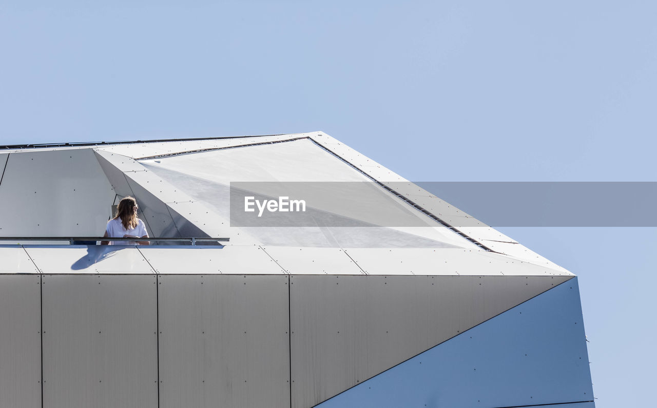 LOW ANGLE VIEW OF PERSON AGAINST SKY