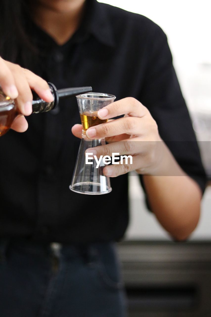 Close-up of a man drinking glass