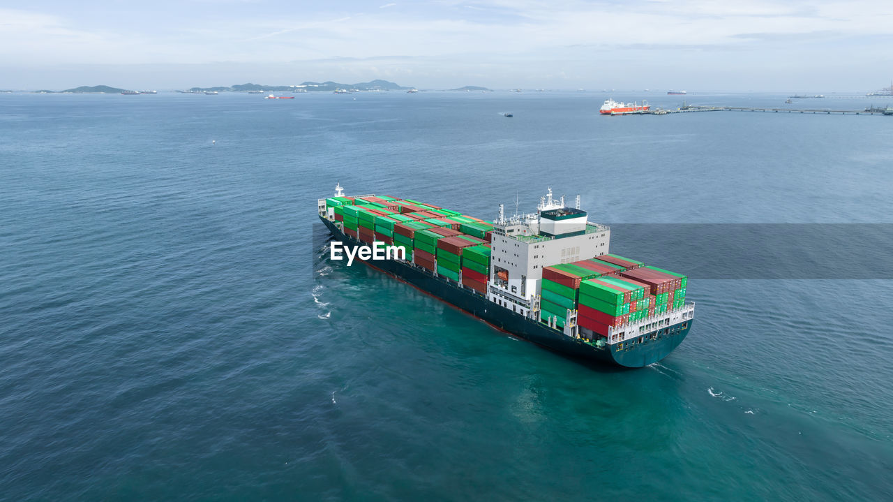 Aerial view container ship full load logistic container, global business logistics import export.