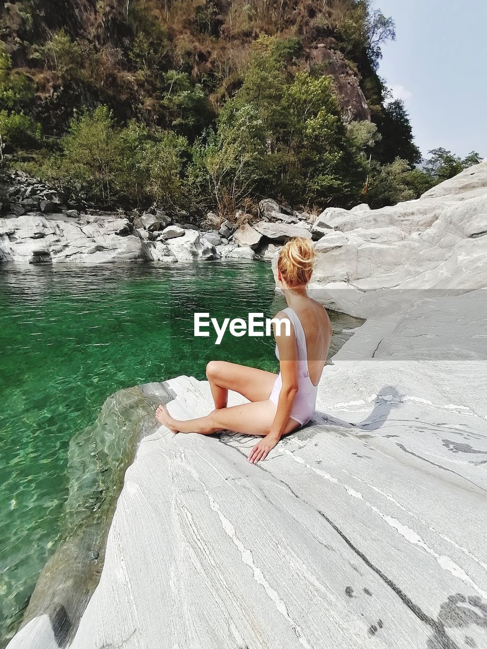 Woman sitting in water