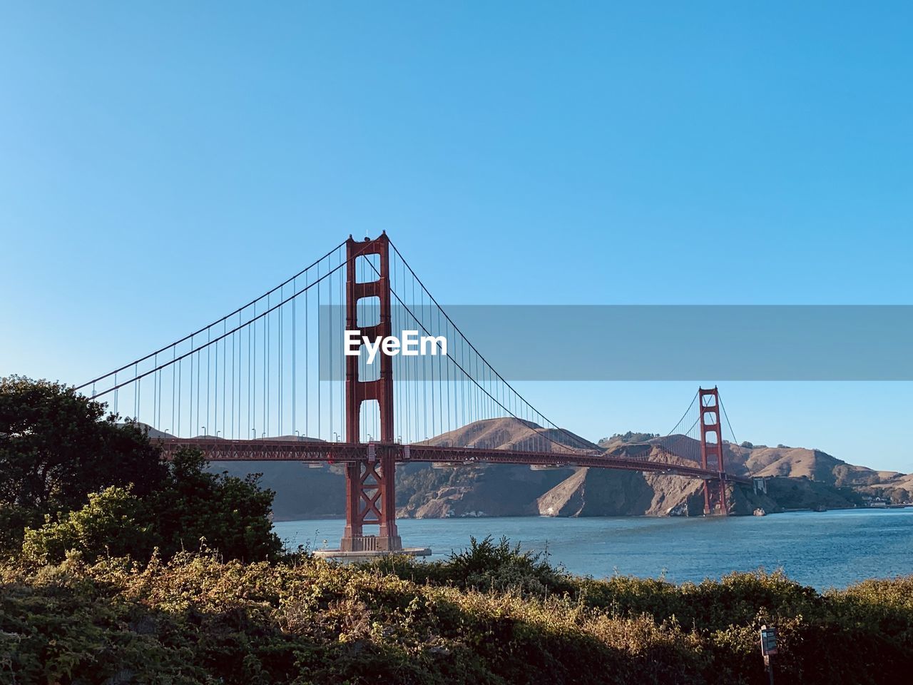 View of suspension bridge against clear sky