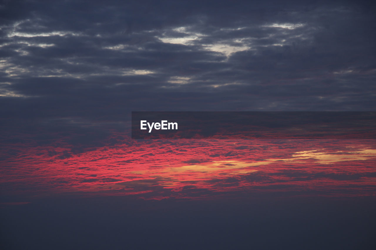 SCENIC VIEW OF DRAMATIC SKY DURING SUNSET