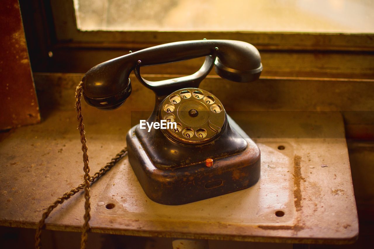 High angle view of telephone on table