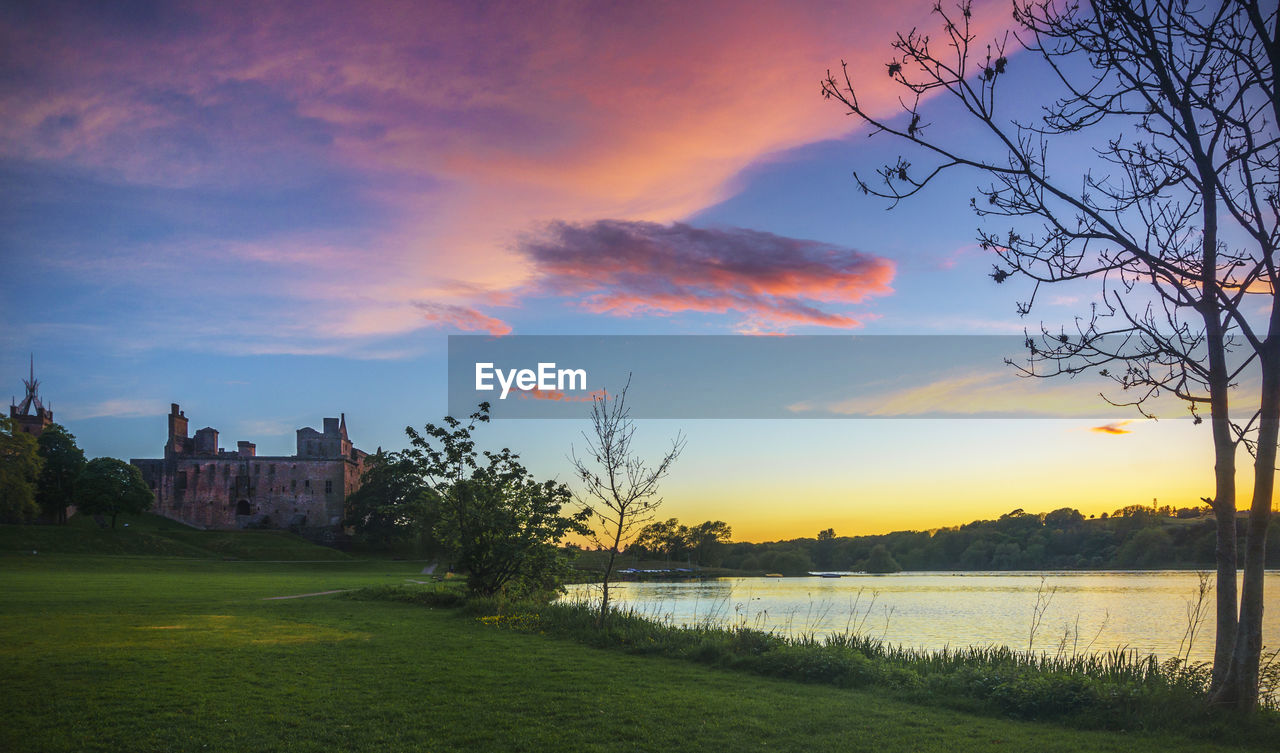 SCENIC VIEW OF LANDSCAPE AGAINST SKY DURING SUNSET