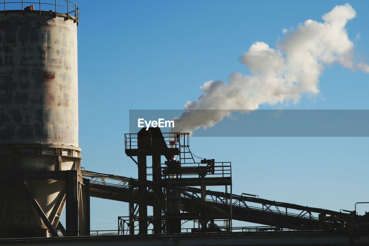 Low angle view of smoke stack against sky /industry