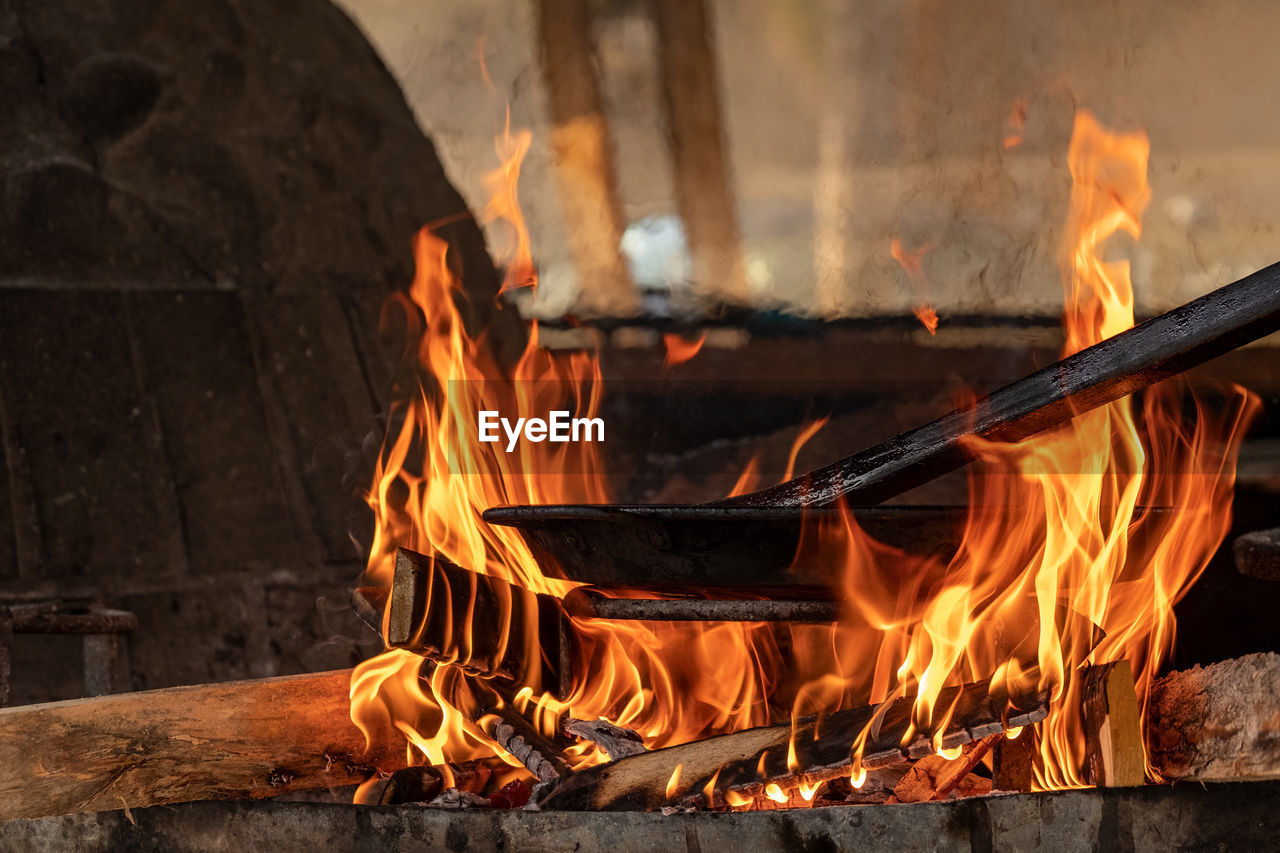 Close-up of fire on log