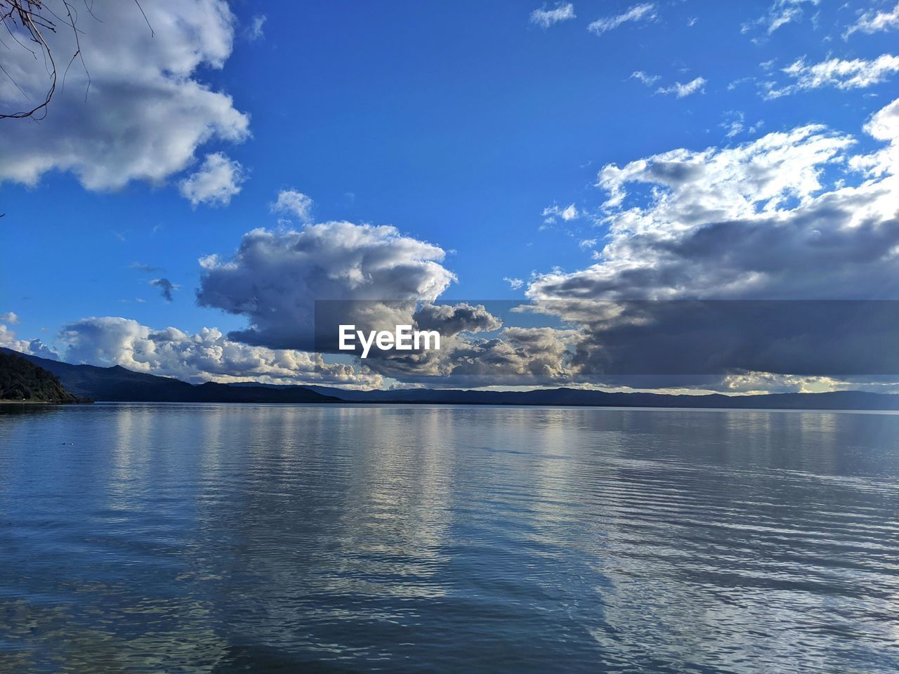 SEA AGAINST BLUE SKY