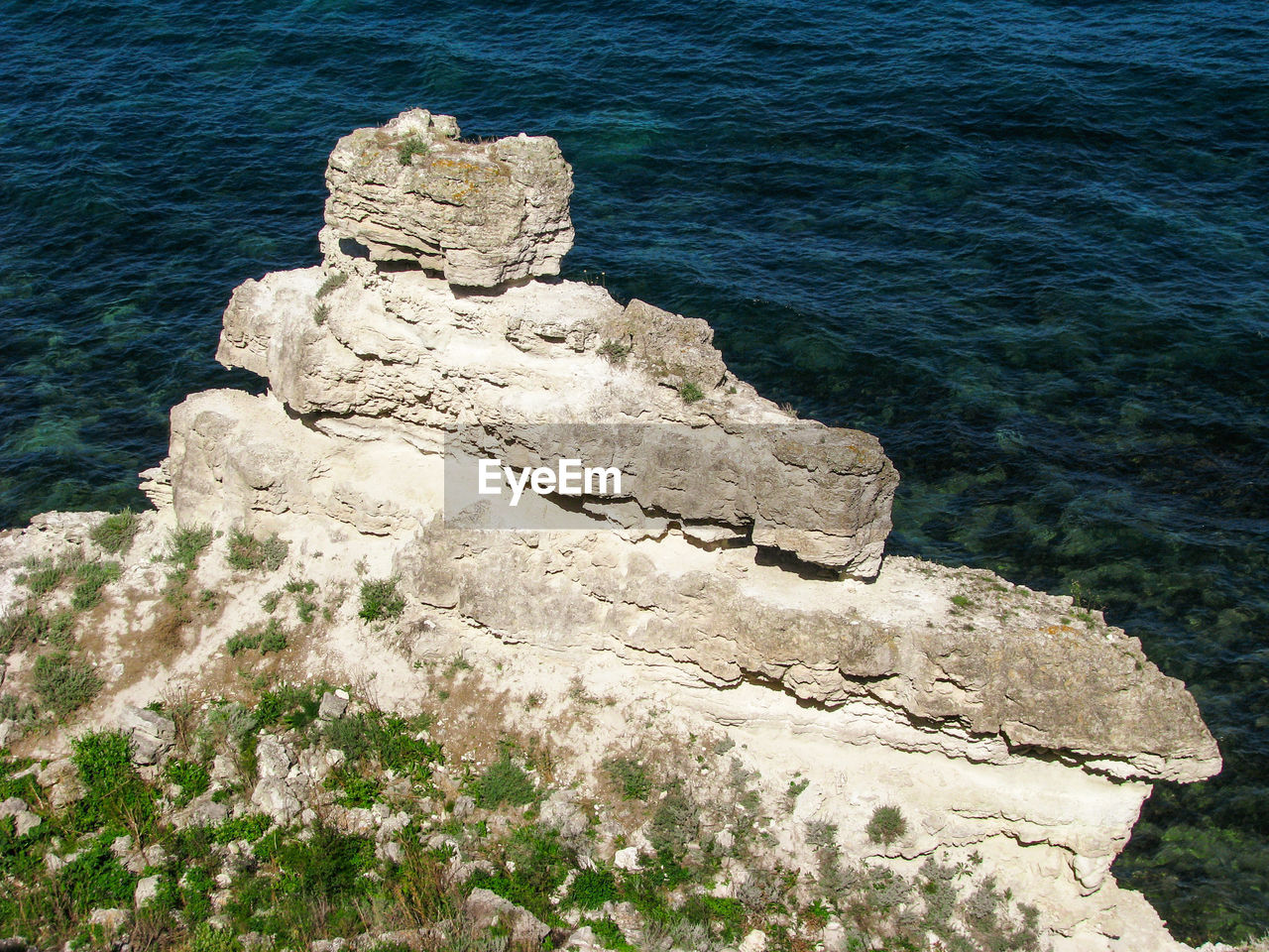 High angle view of rock formation on sea shore