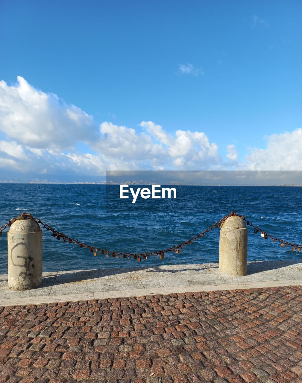 sea, water, sky, horizon, ocean, shore, coast, vacation, cloud, horizon over water, nature, blue, scenics - nature, beach, land, day, no people, beauty in nature, sand, architecture, body of water, travel destinations, rock, outdoors, tranquil scene, travel, tranquility, sunlight, breakwater, bay, built structure, tourism