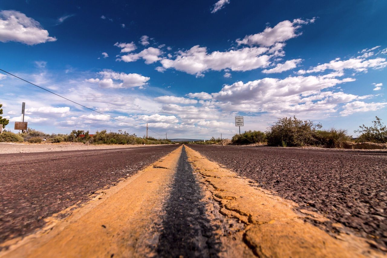 Road amidst landscape against sky