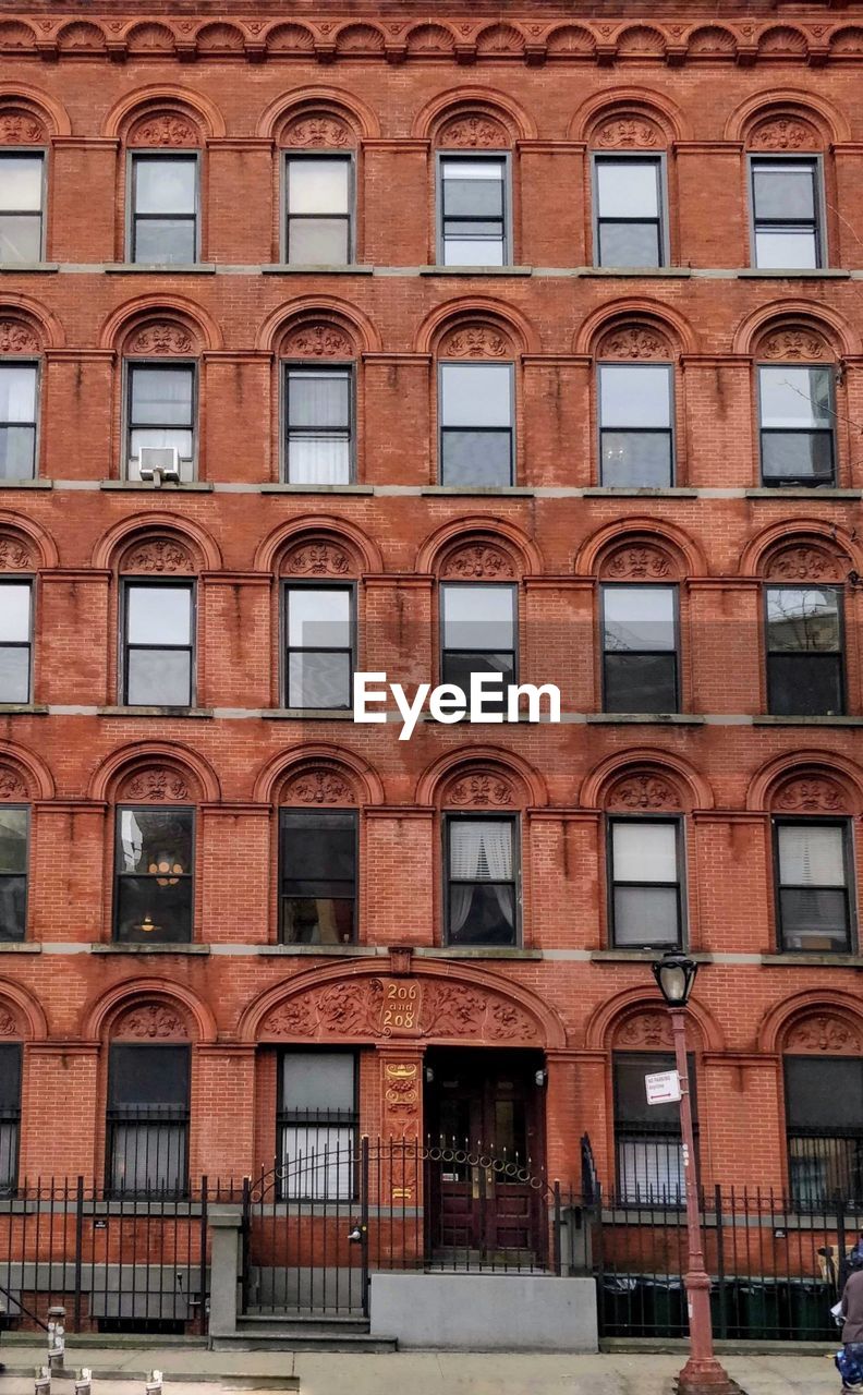 Frontal view of building facade of red brick
