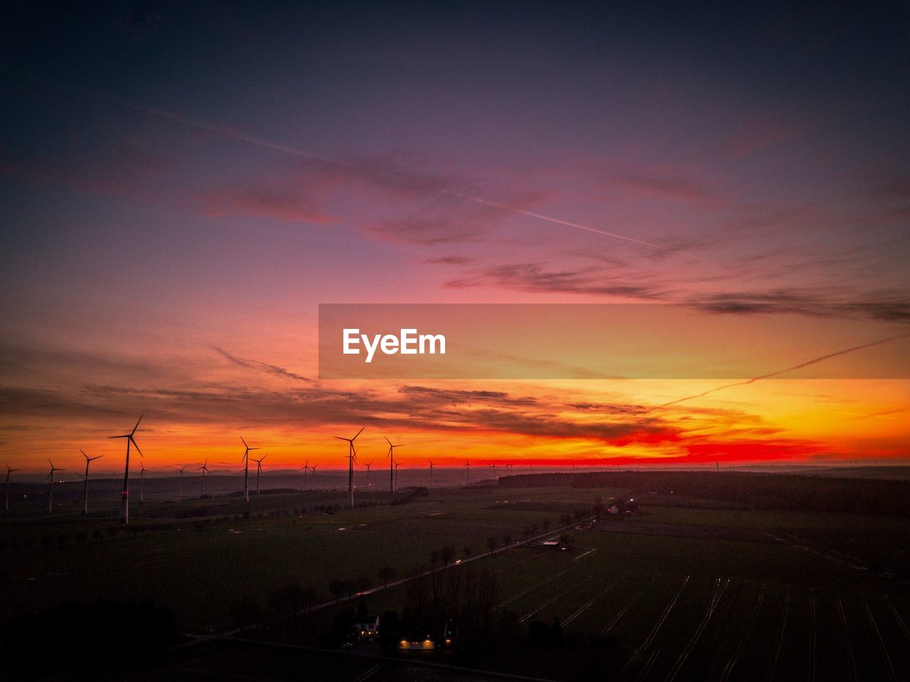 SCENIC VIEW OF FIELD AGAINST SKY AT SUNSET