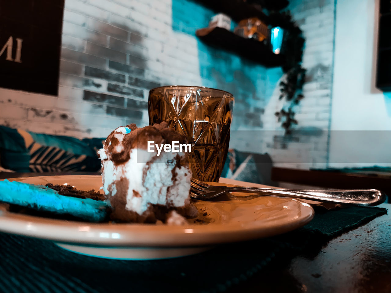 A piece of cake  in plate on table