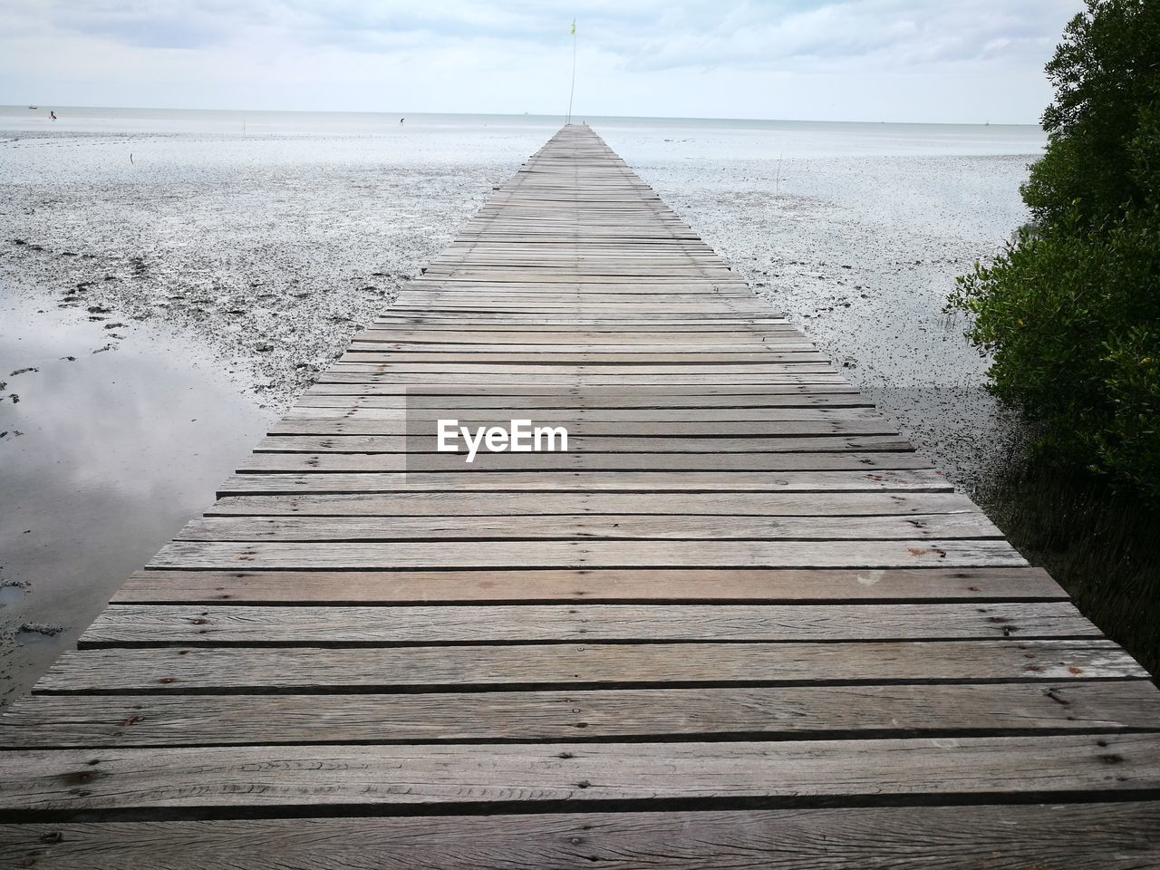 Pier over sea against sky