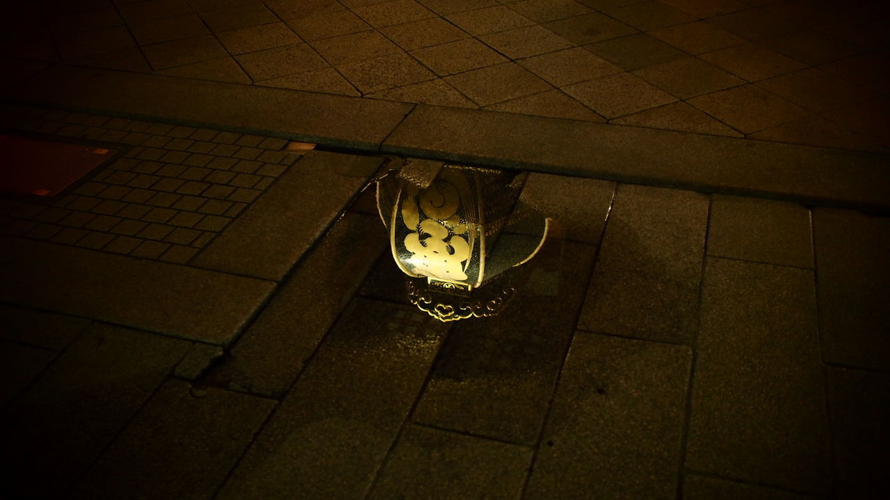 Look what I found in a puddle! Night Hanging No People Indoors  Illuminated Close-up Japan Streetphotography Omdem1 EyeEmNewHerе EyeEm Best Shots ThroughMyLens Darkness And Beauty Outdoors Playing In The Shadows Japan Photography Reflections In The Water