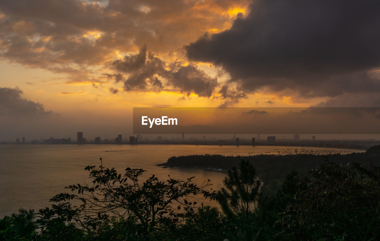 Scenic view of sea against orange sky