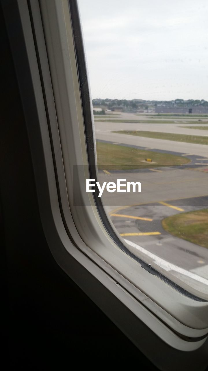 AIRPLANE WING AGAINST SKY