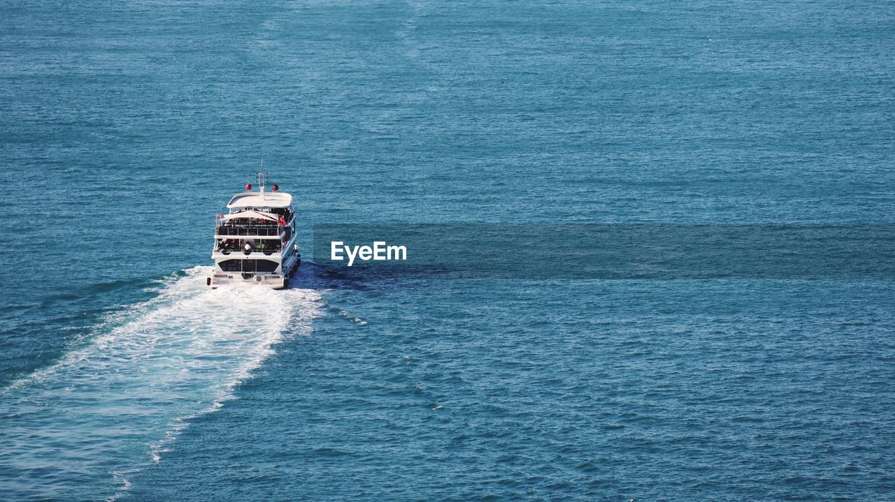 High angle view of ship sailing in sea