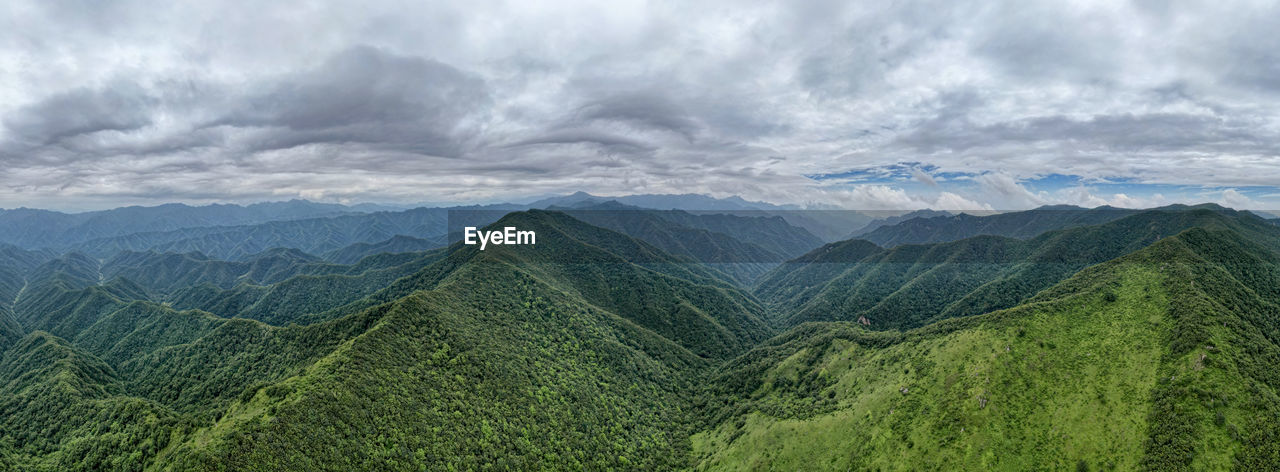 SCENIC VIEW OF VALLEY AGAINST SKY