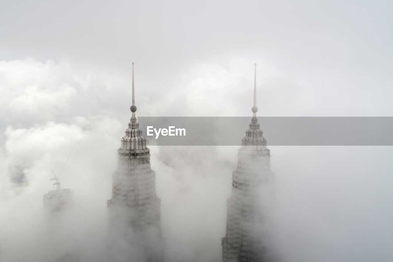 Skyscraper amidst clouds